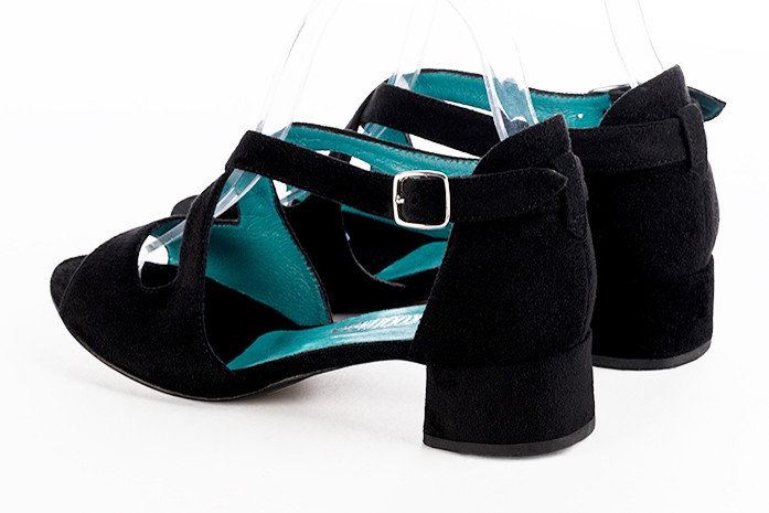 Matt black women's closed back sandals, with crossed straps. Round toe. Low flare heels. Rear view - Florence KOOIJMAN
